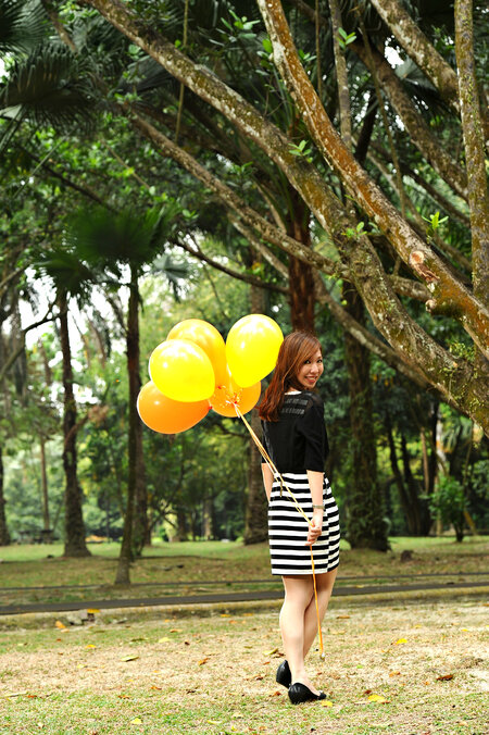 I Am Her: Siew Yen Ng On Finding The Meaning Of Happiness woman holding yellow balloons