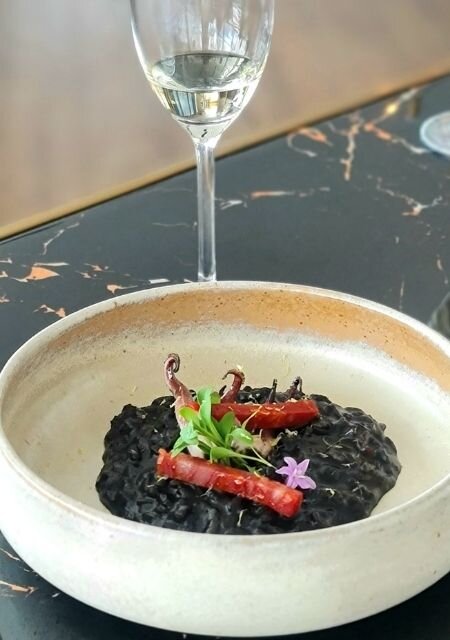 Sotong Hitam Risotto A bowl of Sotong Hitam Risotto