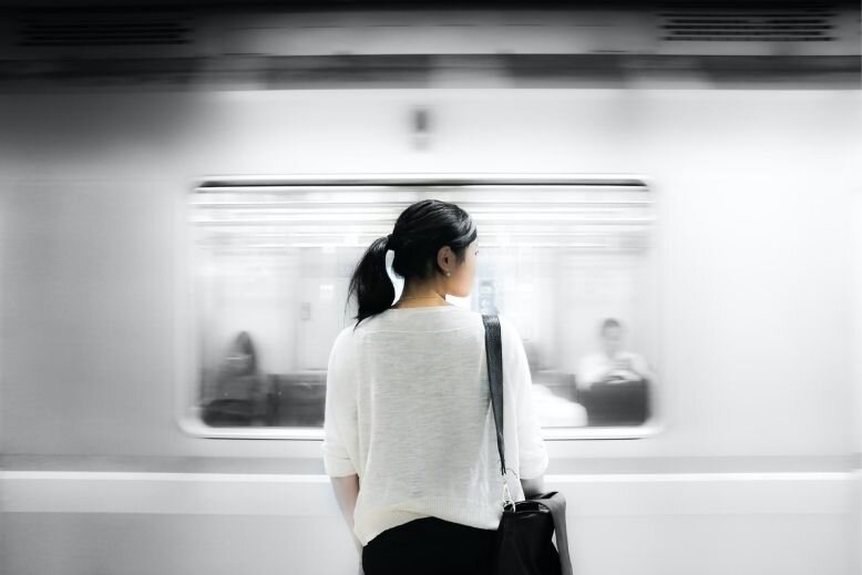 How women a view when they have an unusual illness A girl standing beside a moving train