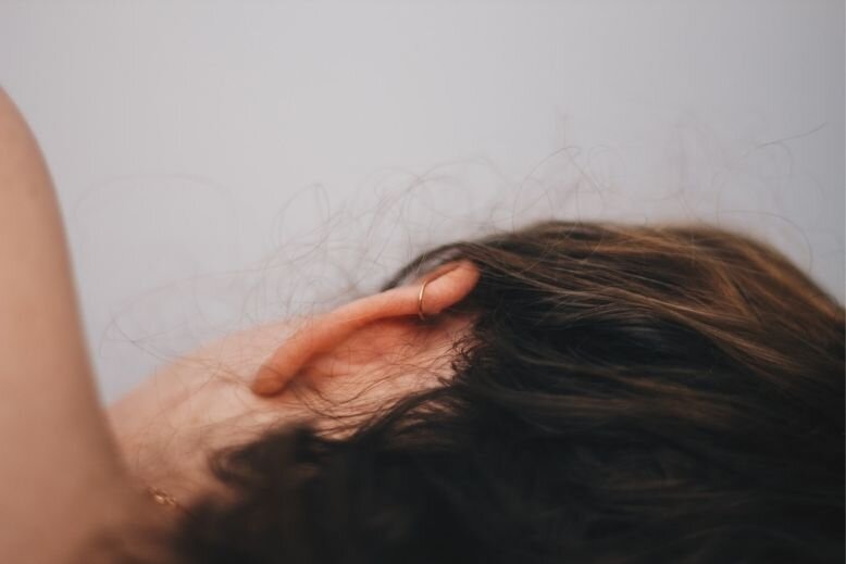 People commenting on their conditions The back of a girl's head showing her ear
