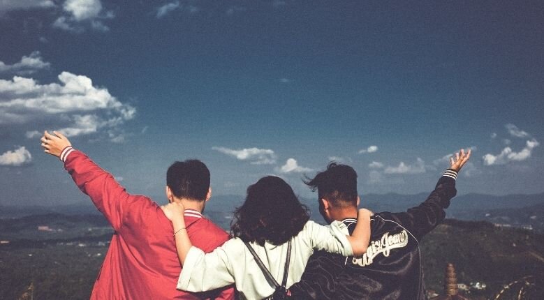 friends with their backs against the camera friends with their backs against the camera