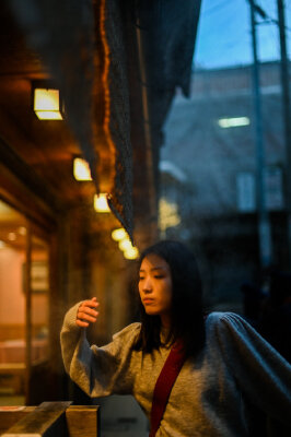 A tourist smells the fresh buns from the oven