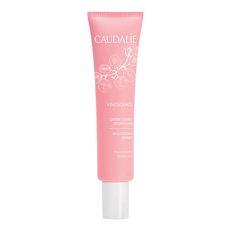 A pink white-capped tube with tiny, minimal floral design.