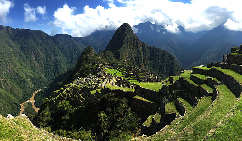 The ruins of Machu Picchu atop mountains