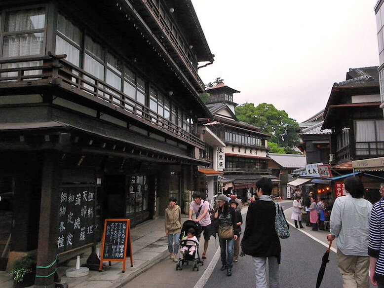 People Walking On The Streets Of Monzen-machi
