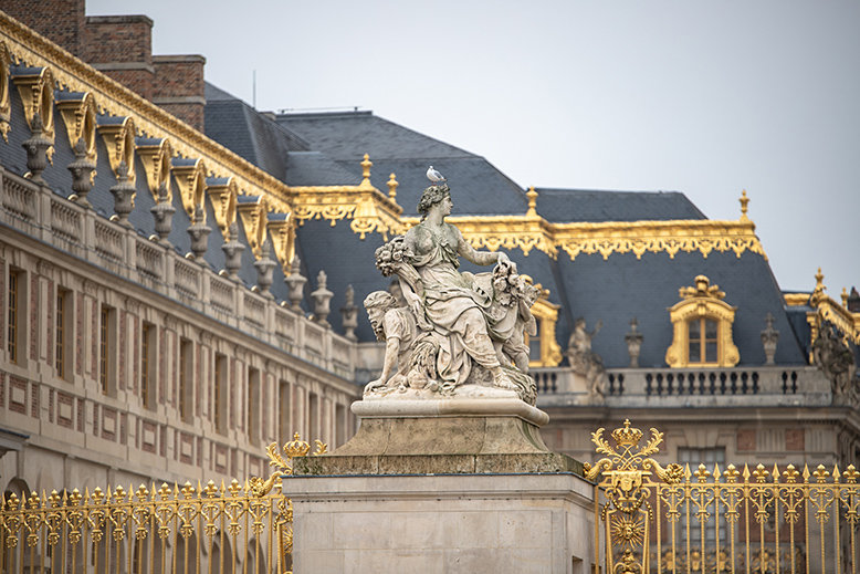 A statue outside the Palace of Versailles