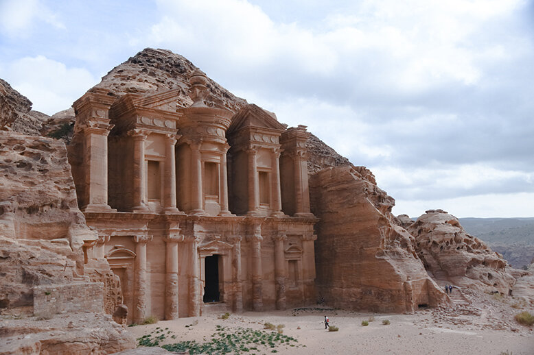 An ancient city entrance carved in a stone wall