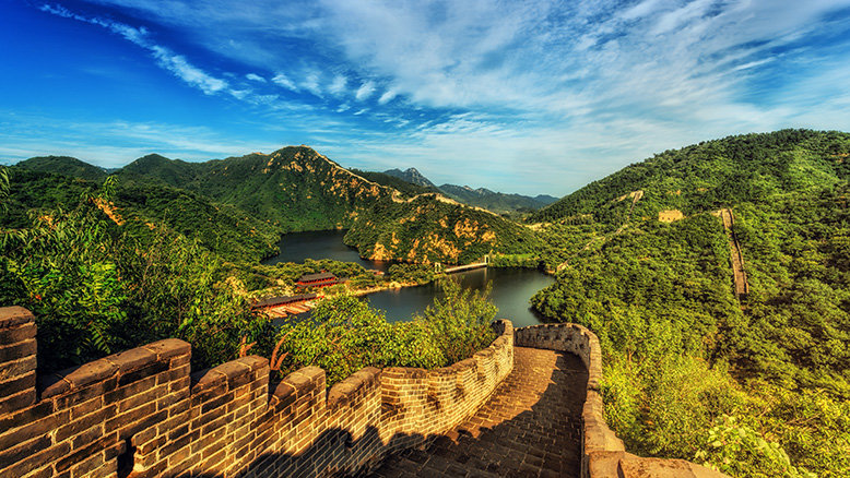 The Great Wall of China spanning miles across lush greenery