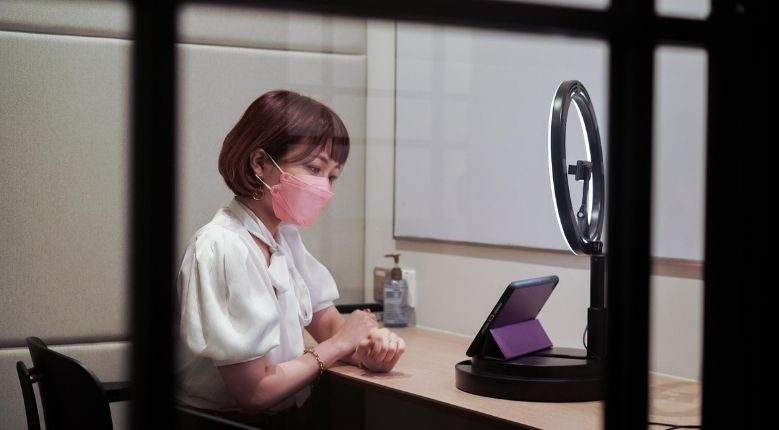 woman in video call wearing a mask