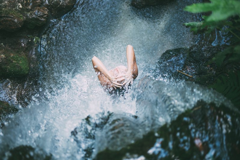 woman bathing in water