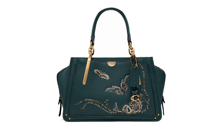 A dark green leather handbag embroidered with butterflies and floral designs.