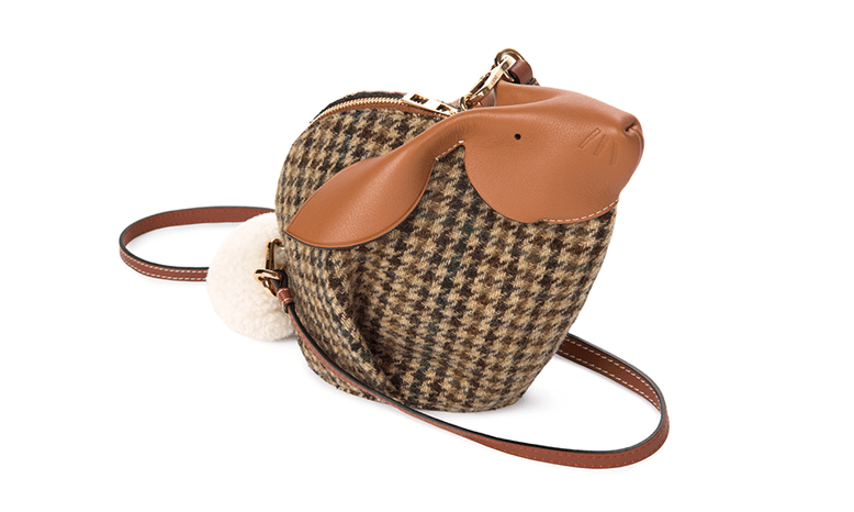 A tweed mini-bag with a bunny-like design.