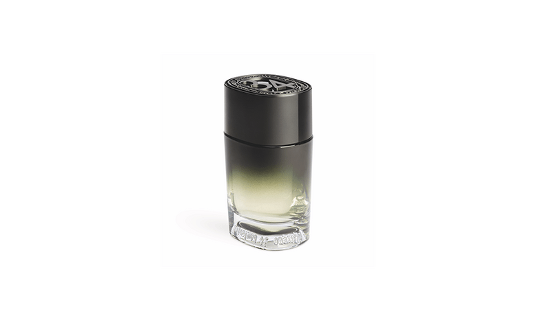 A small bottle of perfume with black cap