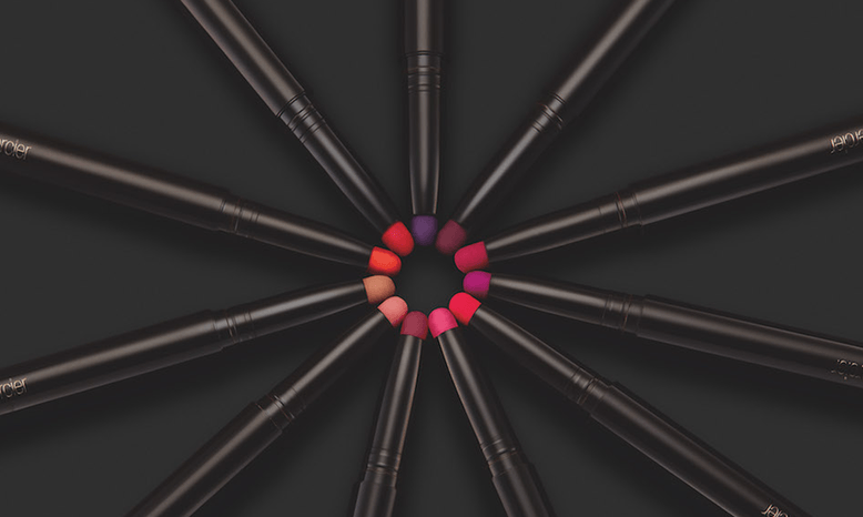 Lipsticks with black casing, with their tips close together to form a circle